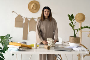 Eco-friendly fashion designers creating sustainable clothing with recycled fabrics and responsible design techniques 