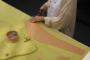 Eco-friendly fashion designers creating sustainable clothing with recycled fabrics and responsible design techniques 